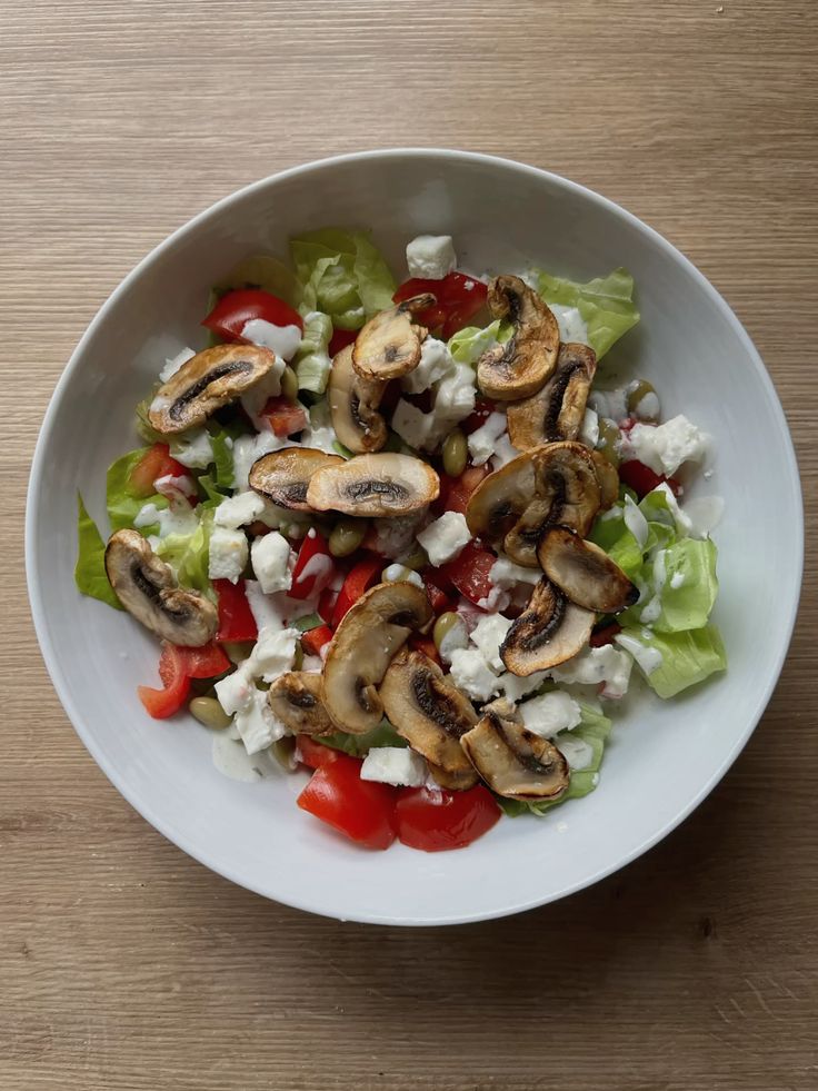 Mushroom salad with tomatoes and feta cheese