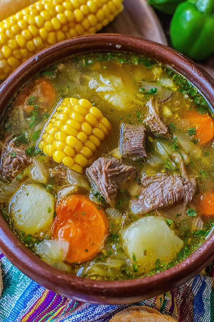 Hearty vegetable and beef soup with corn and carrots